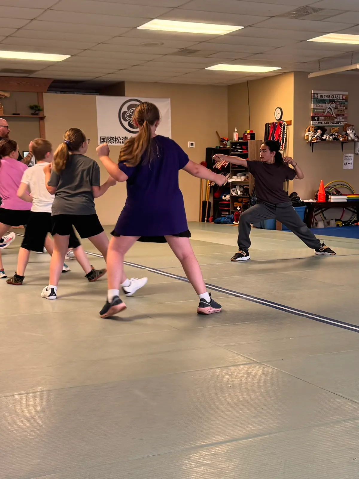 Student driving a lunge during footwork practice