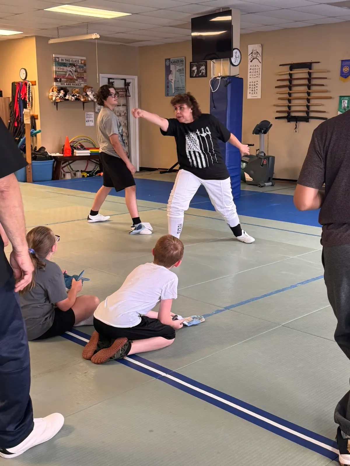 Young students practicing fencing fundamentals