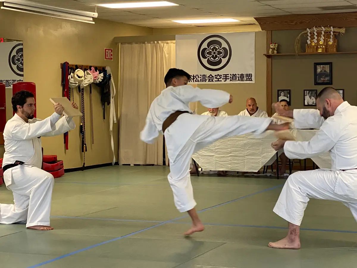 Karate student executing a jumping board break
