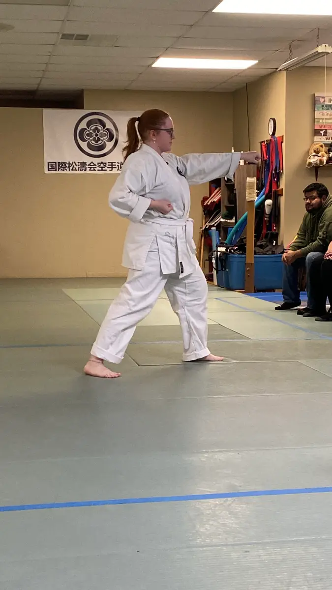 Karate student holding a focused kata stance
