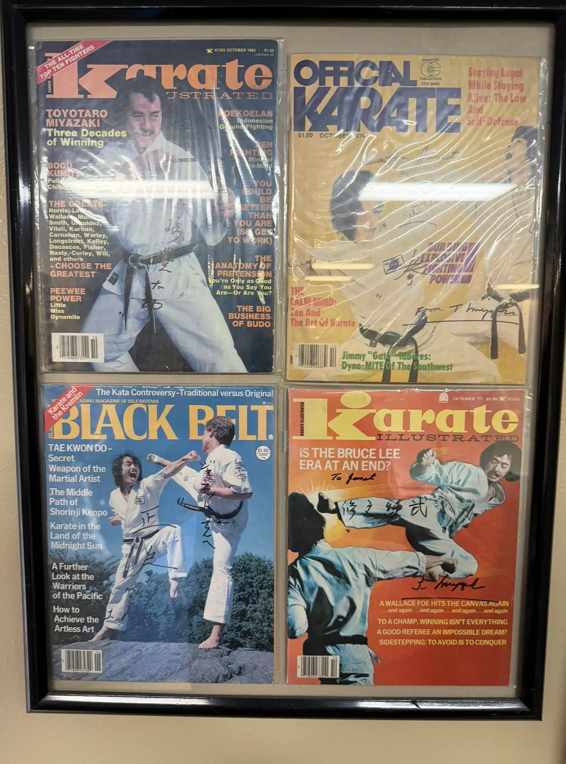Framed vintage martial-arts magazine covers featuring Master Toyotaro Miyazaki, several signed to Sensei Janet