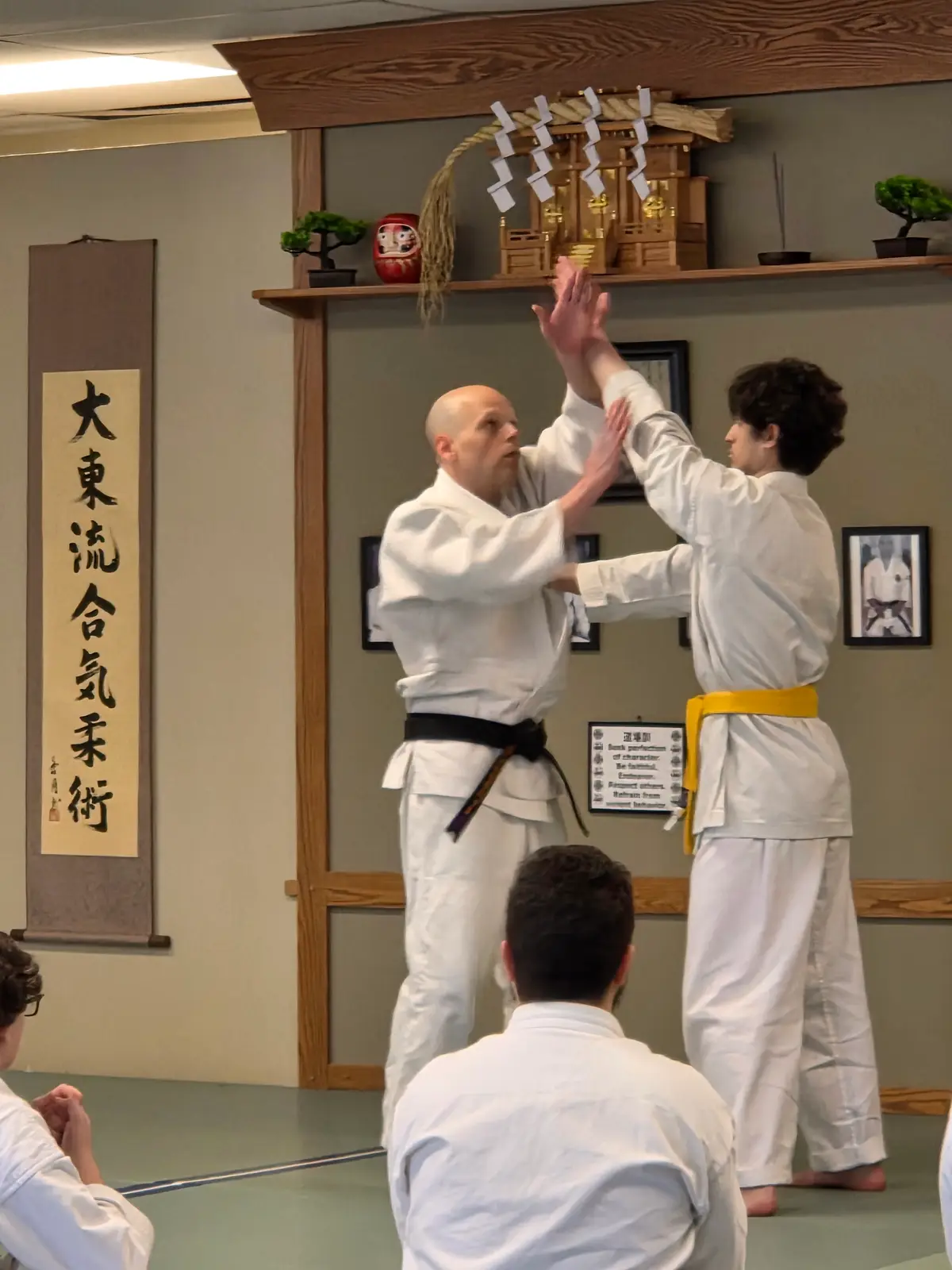Partners practicing a wrist-control technique